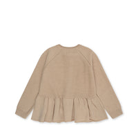 konges-sløjd-cabby-frill-cardigan-almond-milk-kong-w23ks5923-am-3y