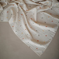 mushie-muslin-swaddle-blanket-organic-cotton-dinosaurs-mush-2200250- (2)