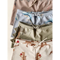 konges-sløjd-aster-swim-pants-dino-overland-trek-kong-s23ks4623-ot-12m