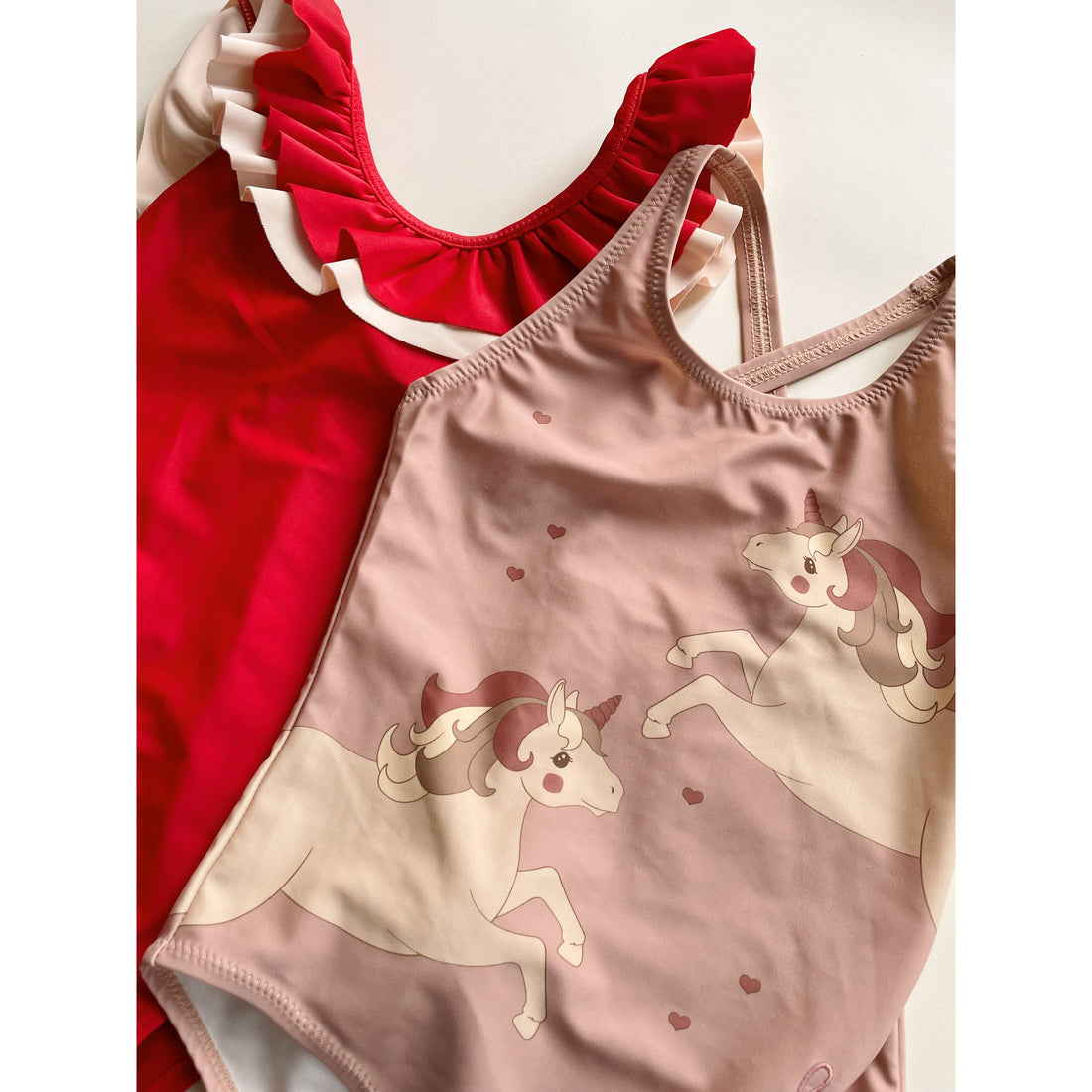 konges-sløjd-cerise-swimsuit-barbados-cherry-kong-s23ks4655-bc-12m