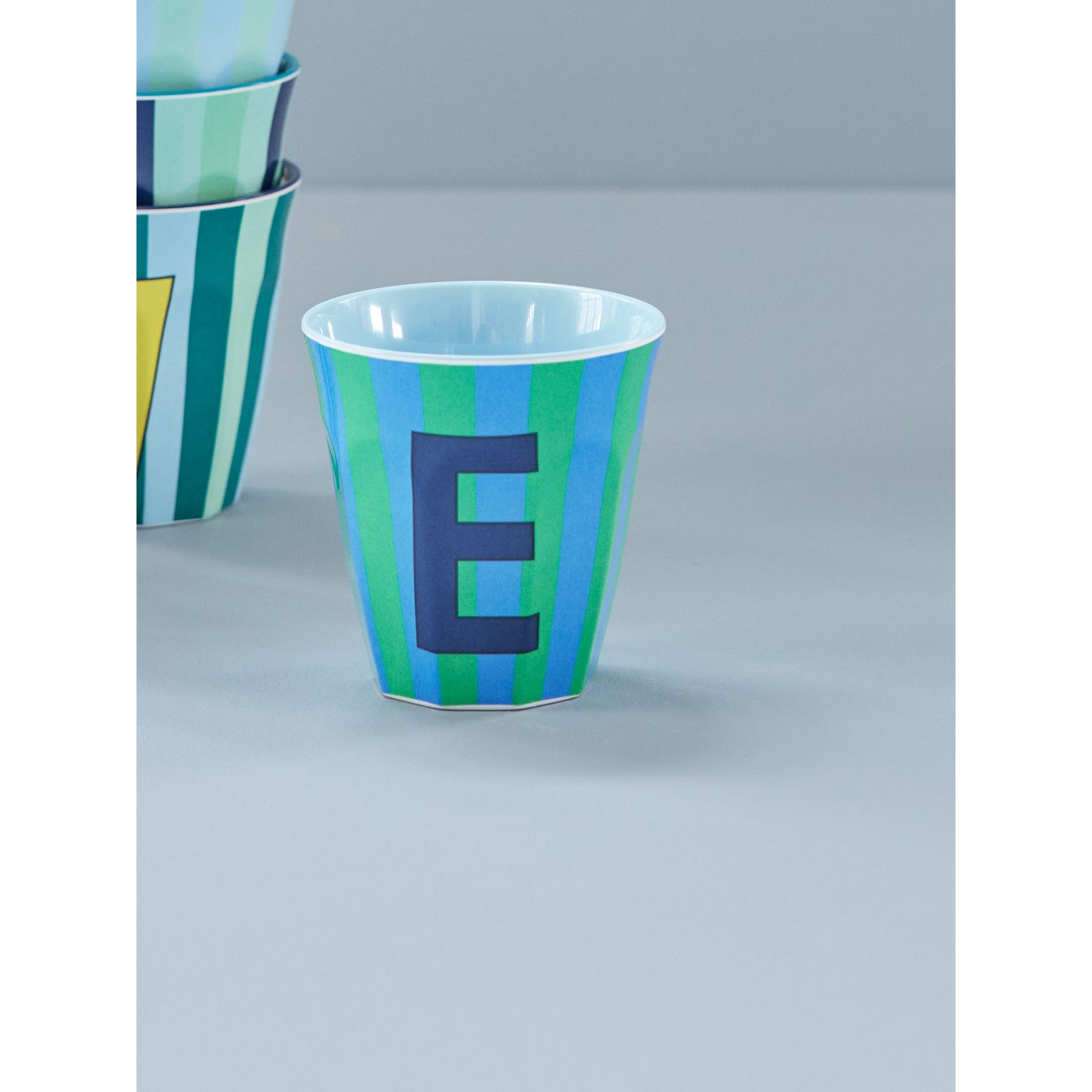 rice-dk-melamine-cup-with-the-letter-e-stripes-blueish-medium-250ml-rice-melcu-alpstreb