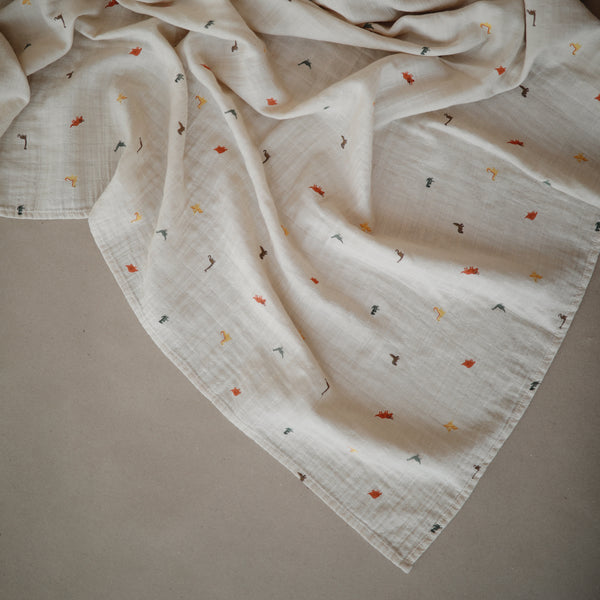 mushie-muslin-swaddle-blanket-organic-cotton-dinosaurs-mush-2200250- (2)